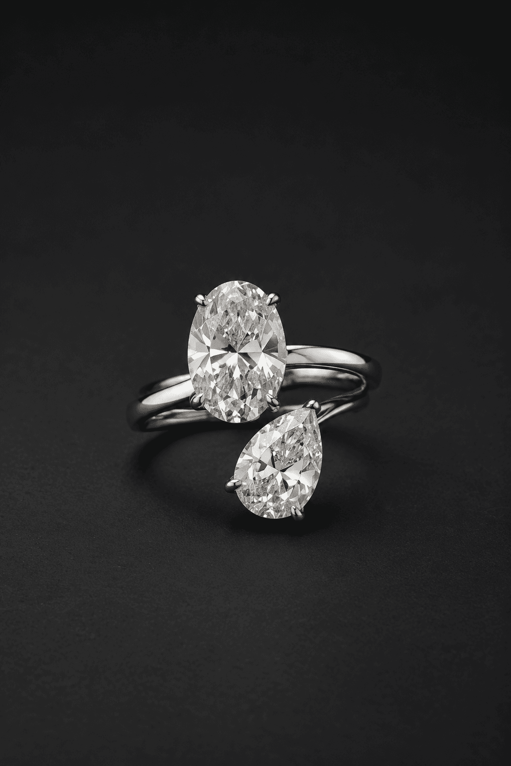 Detailed view of an intricate pear and oval diamond two-stone ring